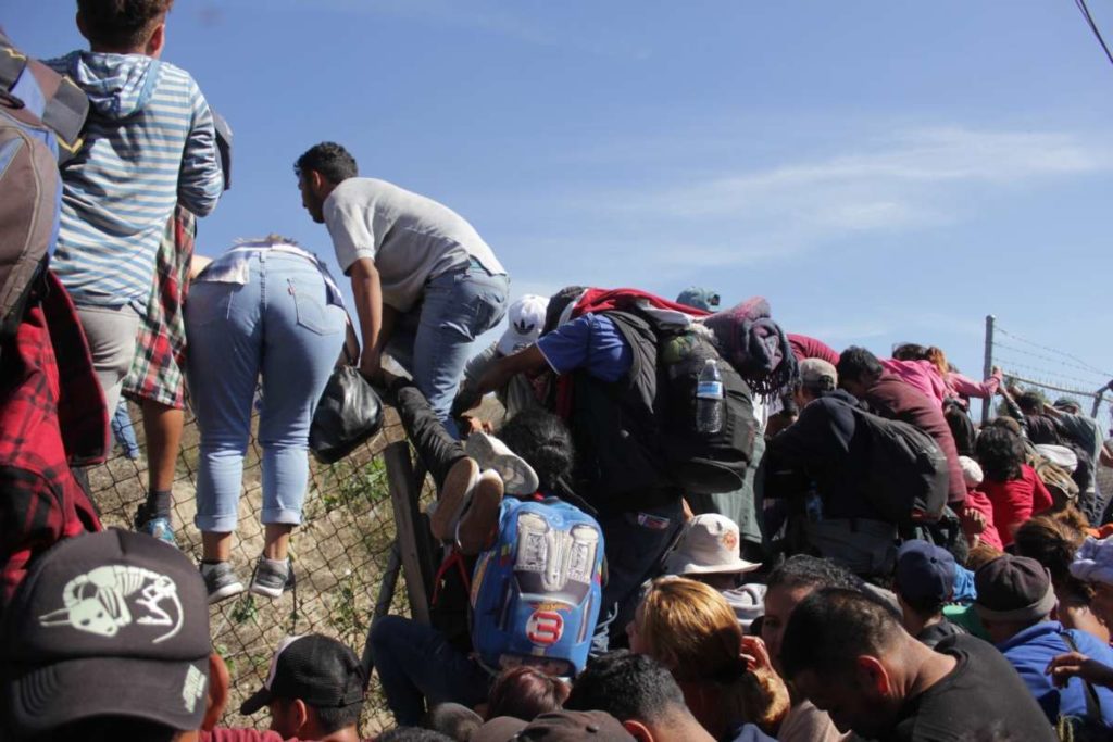 People trying to cross the border between Mexico and US.