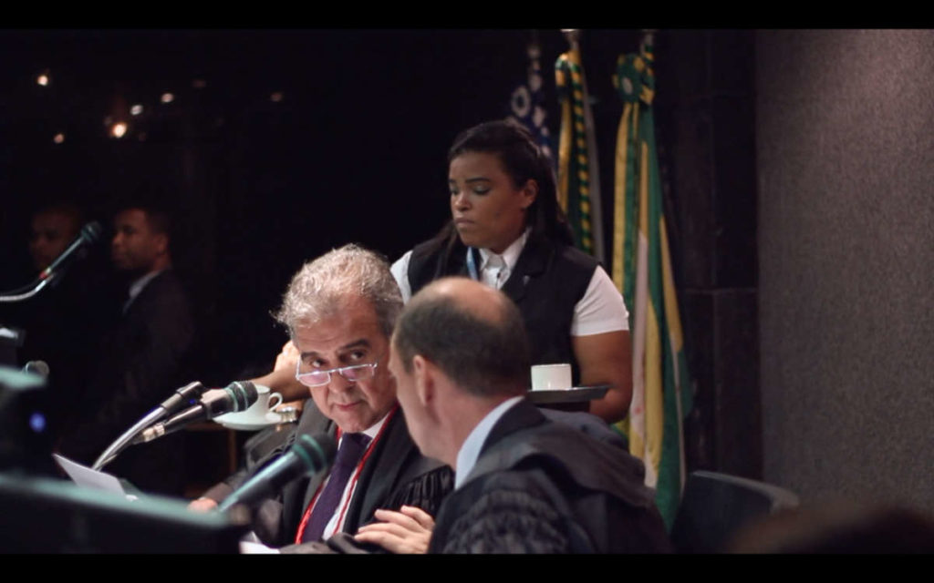 Woman working behind judges